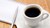 Kaffekop og notatpapir